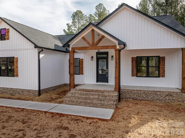 a front view of a house with garage