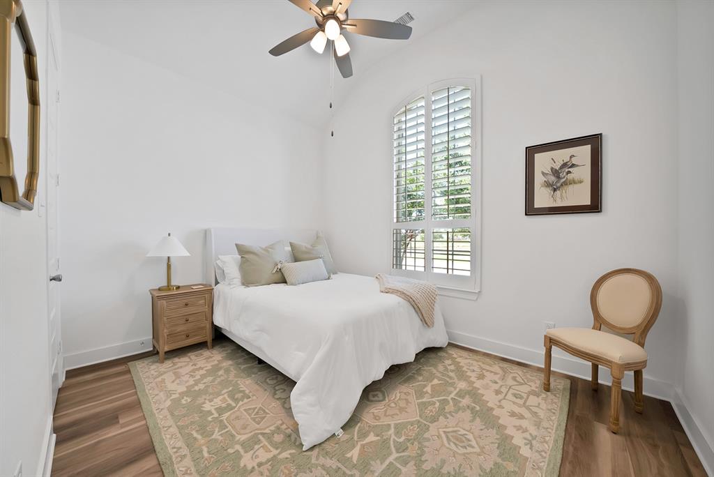 1709 Shetland Road Aubrey, TX 76227 - Photo 24 of 35 a bedroom with a bed window and table chair