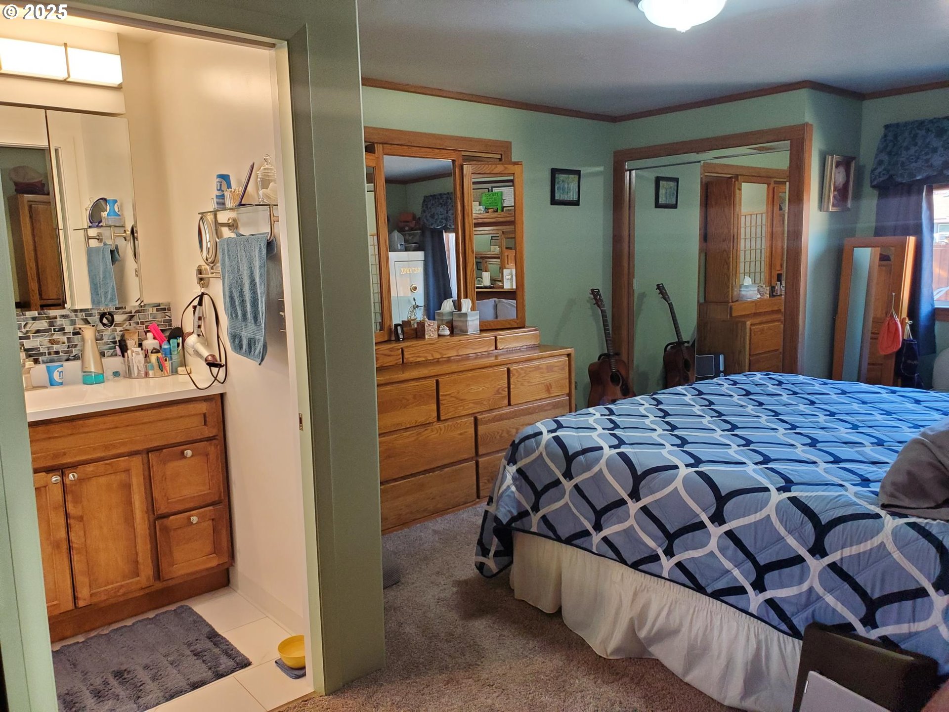 1911 15th Street Baker City, OR 97814 - Photo 16 of 33 a bedroom with a bed and a dresser
