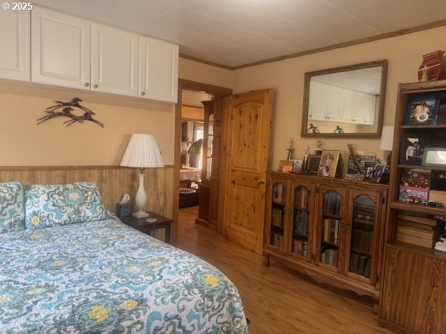 1911 15th Street Baker City, OR 97814 - Photo 18 of 33 a bedroom with a bed a mirror and lamp