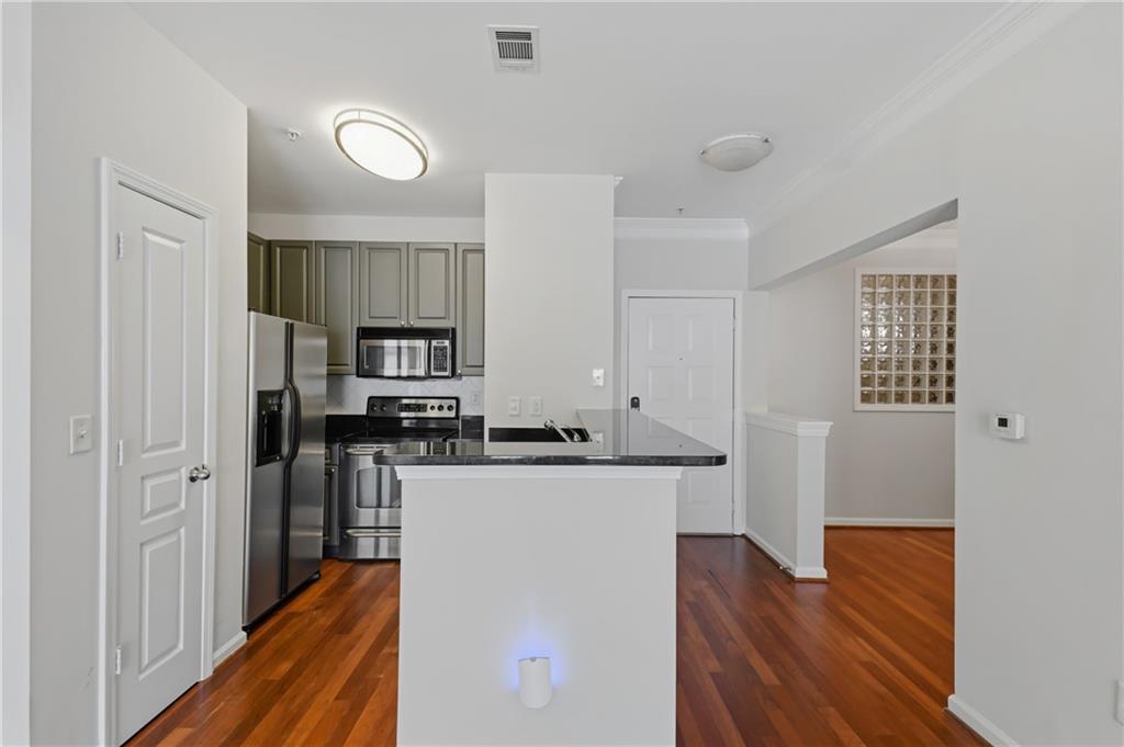 10 Perimeter Summit Boulevard, Unit 3311 Atlanta, GA 30319 - Photo 47 of 68 a kitchen with stainless steel appliances a refrigerator and a stove top oven