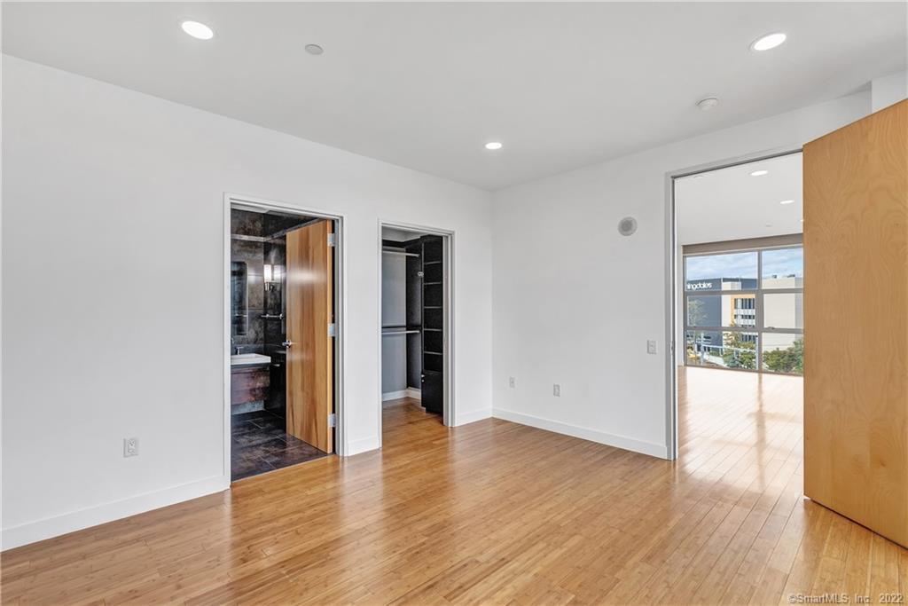 33 North Water Street, Unit 607 Norwalk, CT 06854 - Photo 16 of 40 wooden floor in an empty room with a window