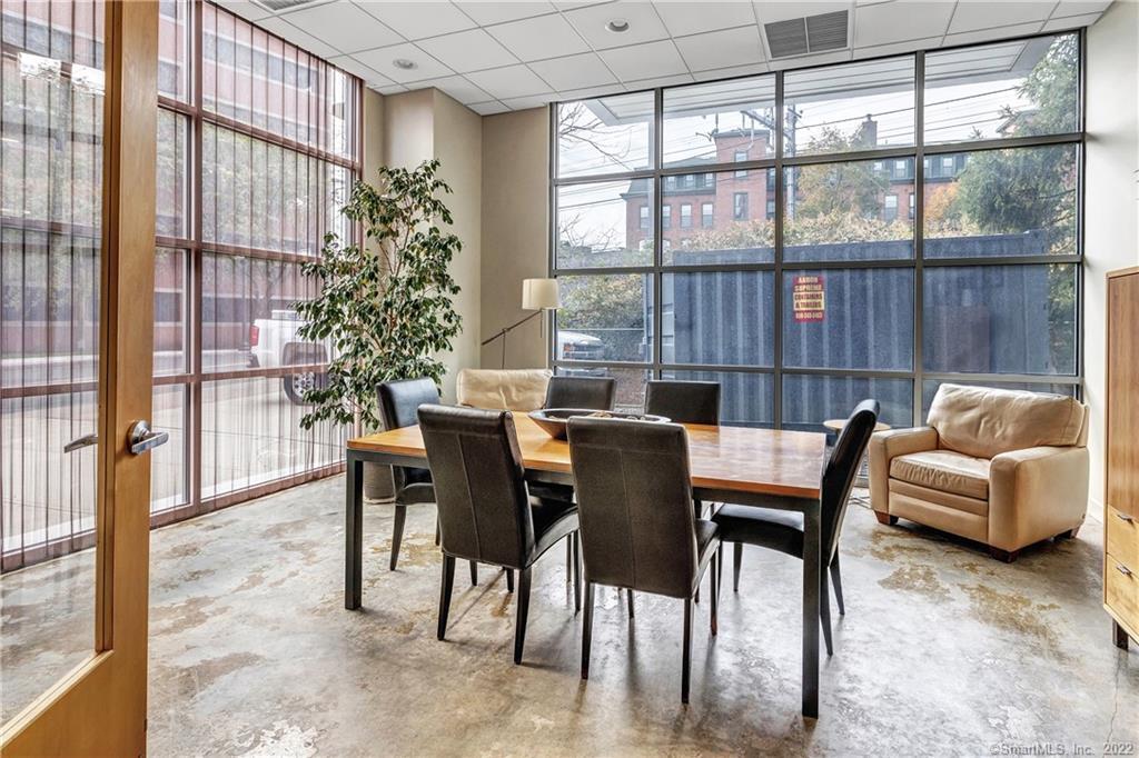 33 North Water Street, Unit 607 Norwalk, CT 06854 - Photo 35 of 40 a dining room with furniture and a window