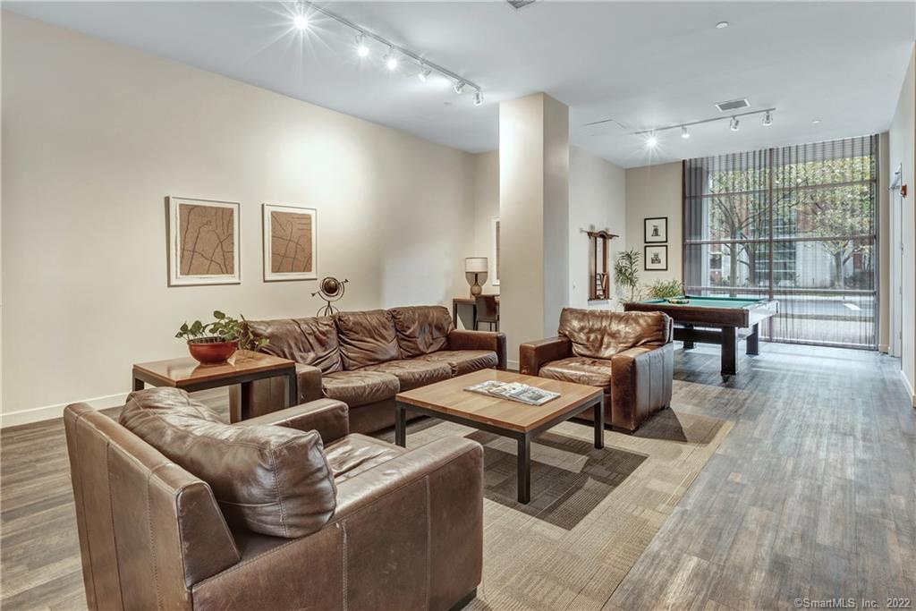 33 North Water Street, Unit 607 Norwalk, CT 06854 - Photo 40 of 40 a living room with furniture and wooden floor