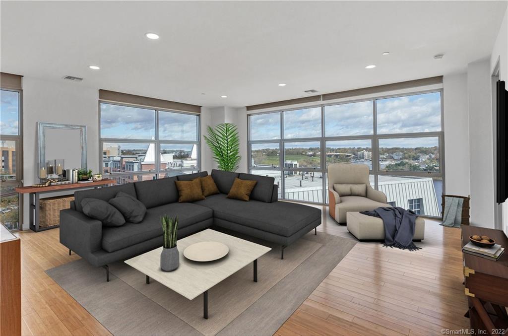 33 North Water Street, Unit 607 Norwalk, CT 06854 - Photo 4 of 40 a living room with furniture and a large window