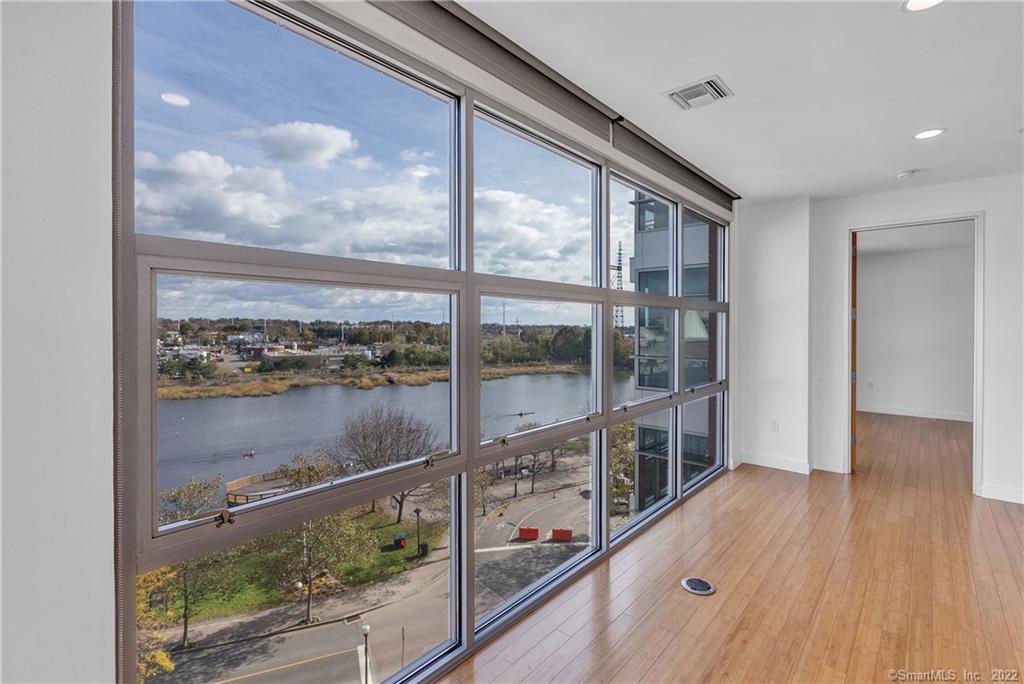 33 North Water Street, Unit 607 Norwalk, CT 06854 - Photo 10 of 40 a view of a glass door with a balcony