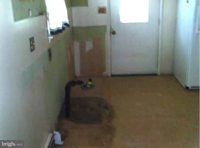 1216 Random Ridge Road Westminster, MD 21157 - Photo 3 of 6 an empty room with a door
