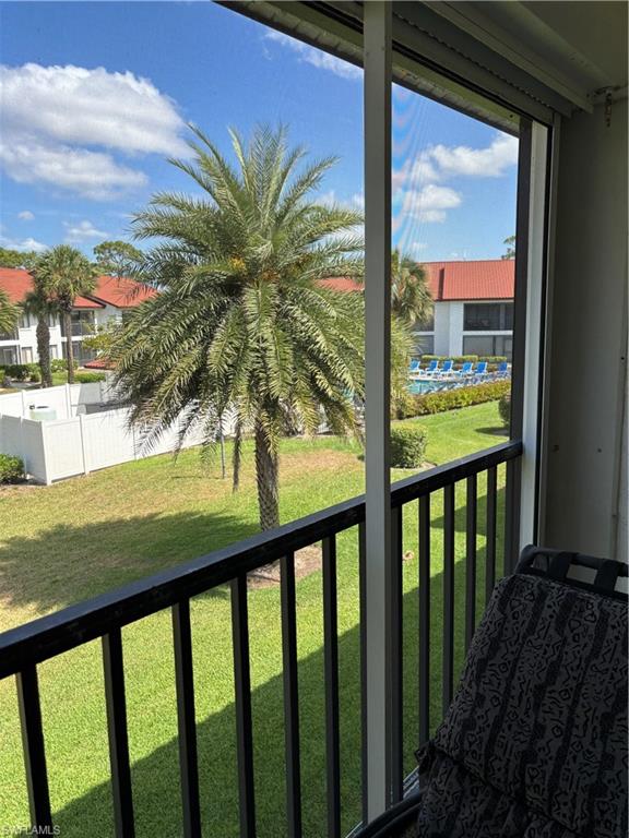 4983 Pepper Circle, Unit H201 Naples, FL 34113 - Photo 12 of 17 a view of balcony and yard