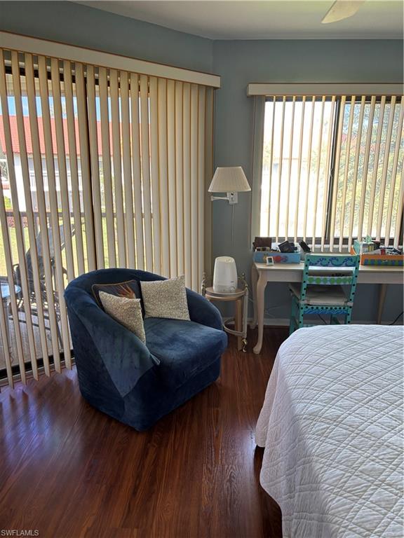 4983 Pepper Circle, Unit H201 Naples, FL 34113 - Photo 13 of 17 a living room with furniture and a large window