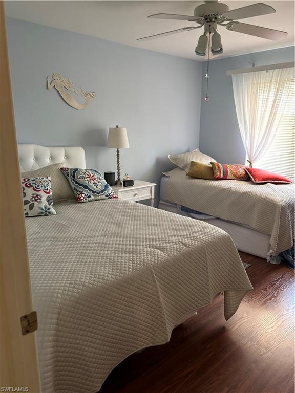 4983 Pepper Circle, Unit H201 Naples, FL 34113 - Photo 17 of 17 a bedroom with a bed and window