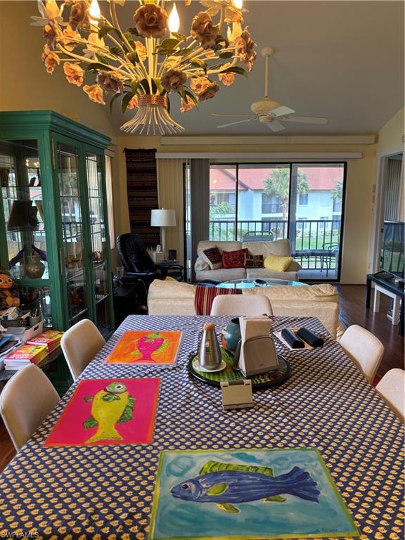 4983 Pepper Circle, Unit H201 Naples, FL 34113 - Photo 7 of 17 a bedroom with furniture and a large window