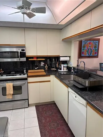 a balcony view with a table and chairs