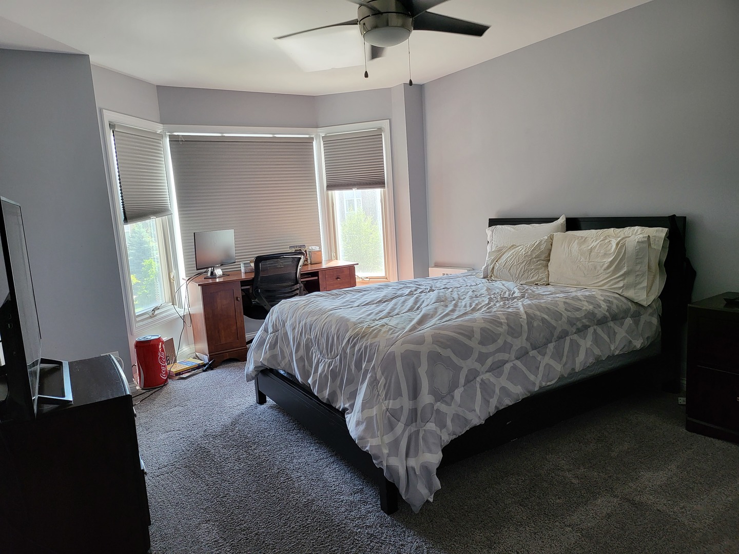 201 Thames Parkway, Unit 2K Park Ridge, IL 60068 - Photo 5 of 9 a spacious bedroom with a bed and a chandelier