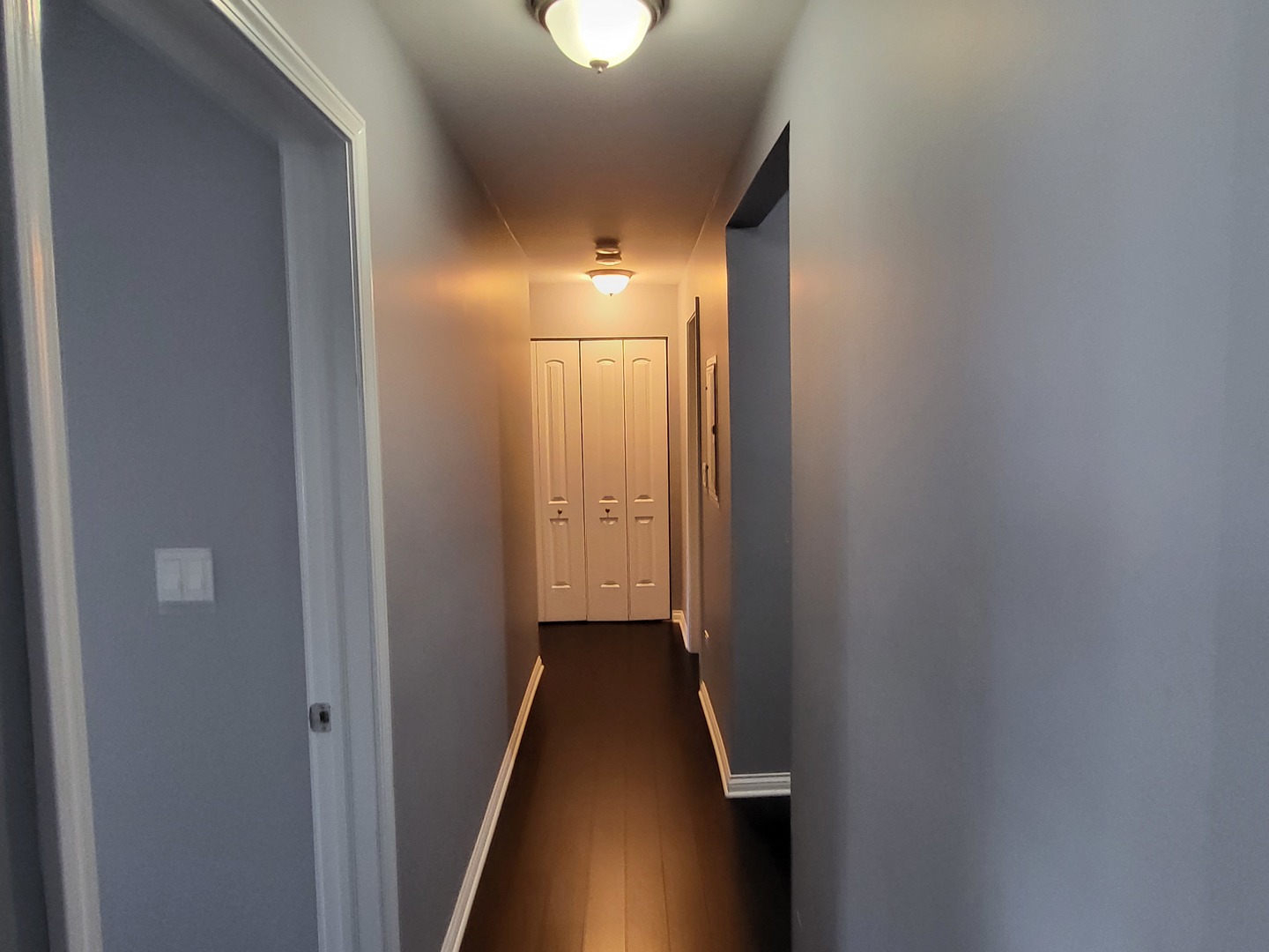 201 Thames Parkway, Unit 2K Park Ridge, IL 60068 - Photo 7 of 9 a view of a hallway with wooden floor