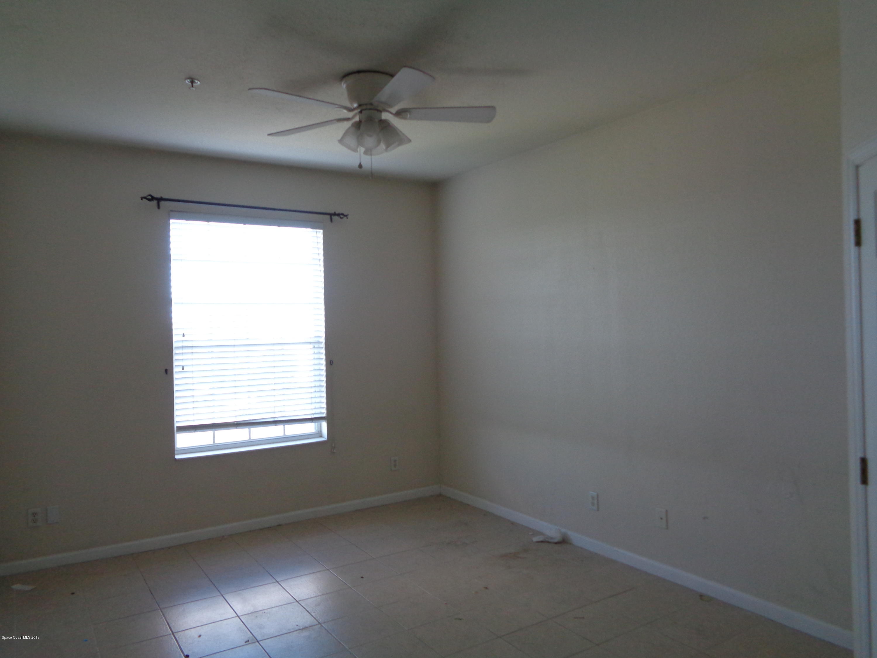 3848 Lexmark Lane, Unit 406 Rockledge, FL 32955 - Photo 5 of 17 Master Bedroom Tile