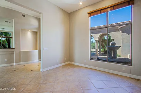a view of a room with wooden floor and windows
