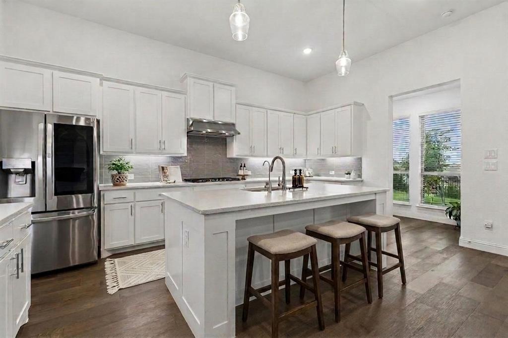 Refrigerator stays with the property. Like to cook together? This kitchen has a gas cooktop and plenty of prep space.