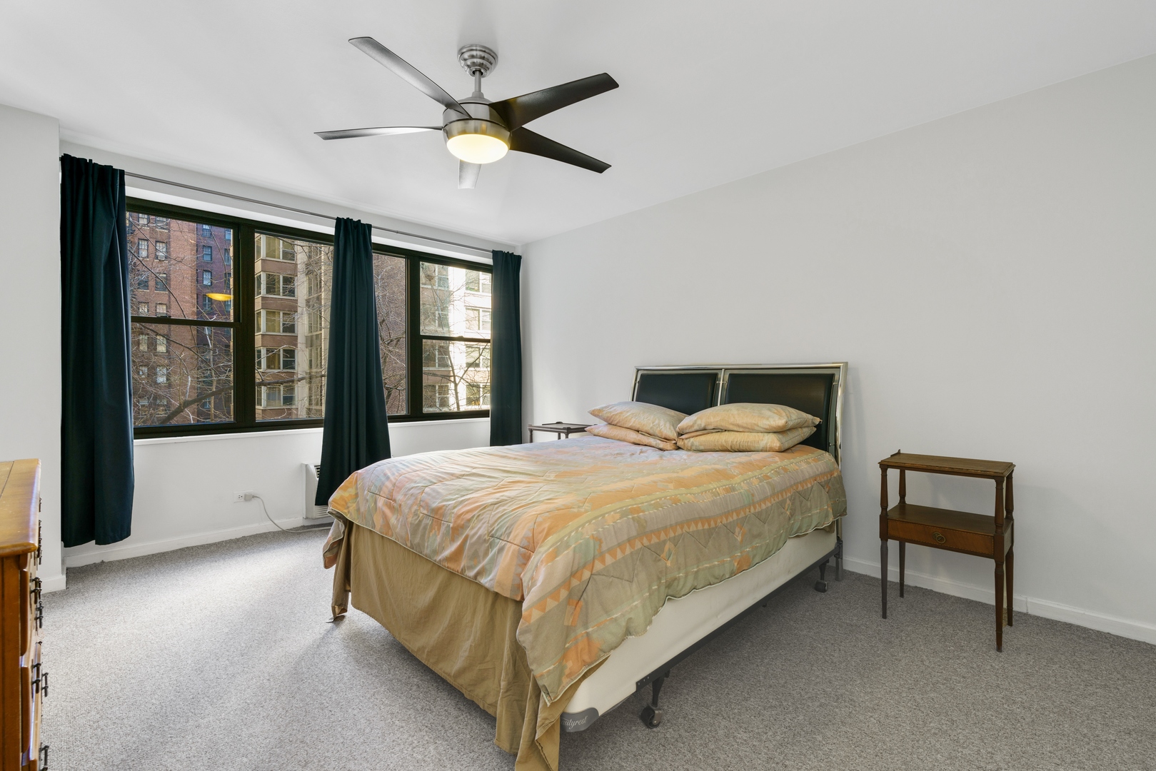 850 North Dewitt Place, Unit 4G Chicago, IL 60611 - Photo 6 of 12 a bedroom with a large bed and a large window