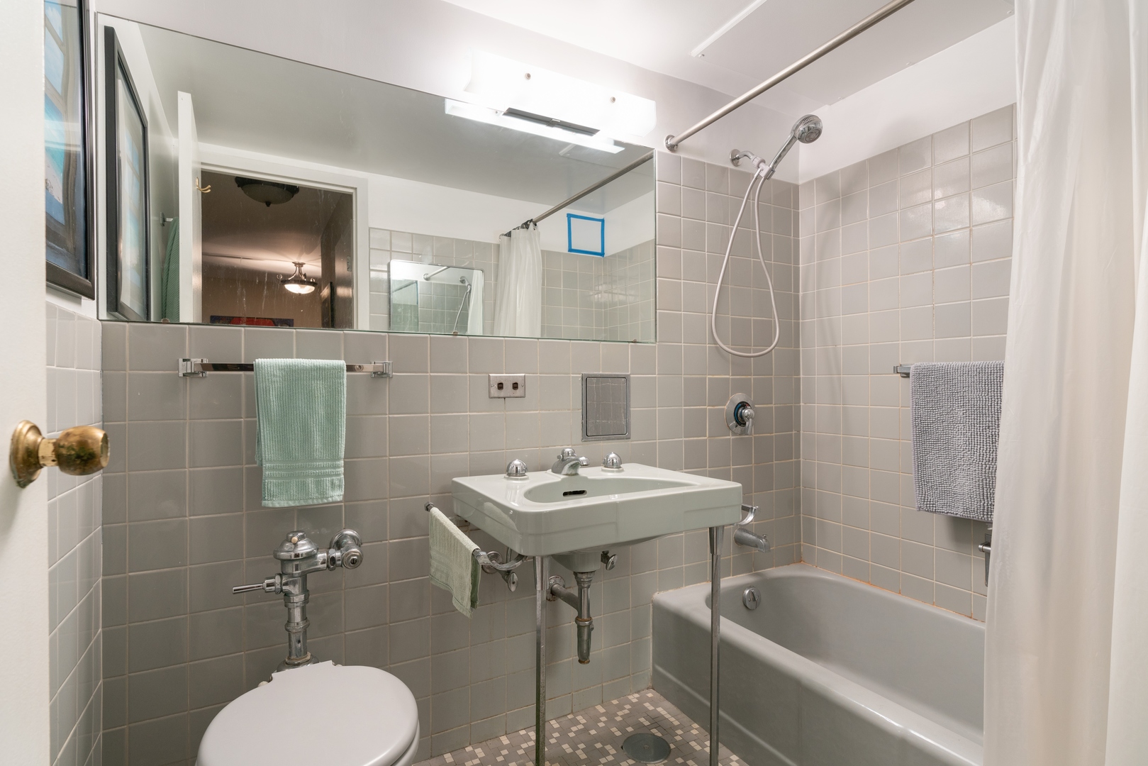 850 North Dewitt Place, Unit 4G Chicago, IL 60611 - Photo 8 of 12 a bathroom with a sink a toilet and shower