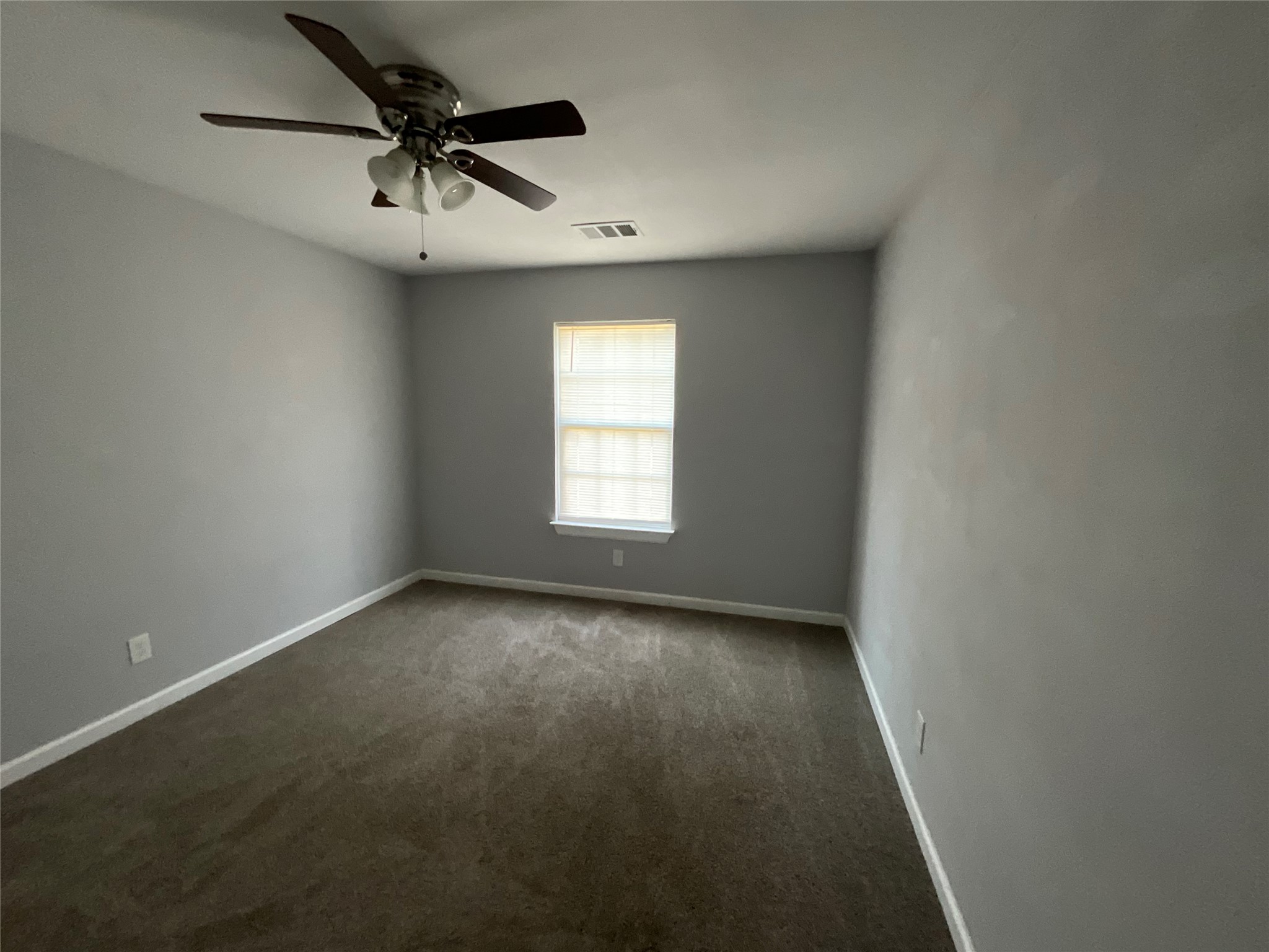 239 Old Firetower Road Bastrop, TX 78602 - Photo 32 of 39 Empty room featuring dark colored carpet and ceiling fan