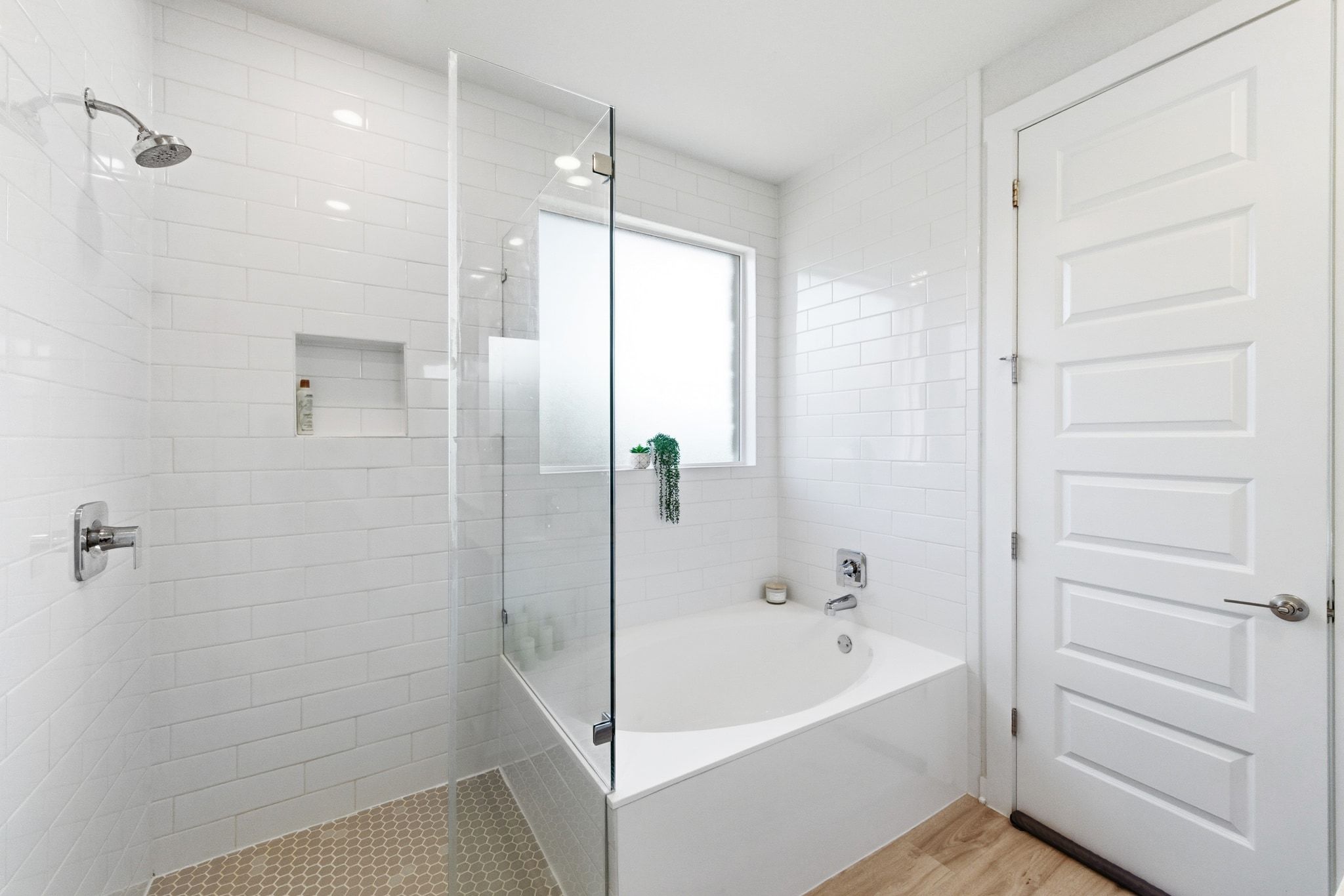 4420 Ingram Road Georgetown, TX 78628 - Photo 19 of 40 Bathroom featuring a garden tub, a walk in shower, and light wood finished floors