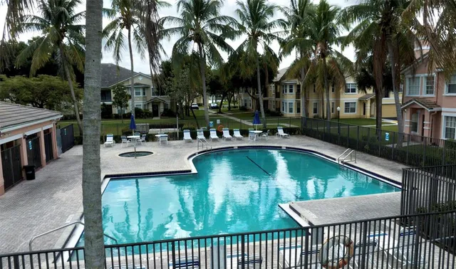 a view of swimming pool with outdoor seating