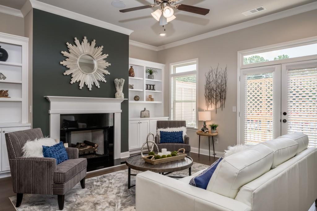 3311 Sangster Way, Unit 202 Decatur, GA 30032 - Photo 1 of 1 a living room with furniture chandelier and a fireplace