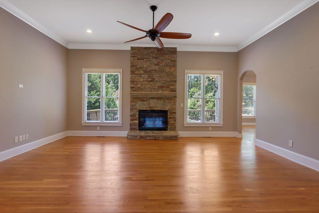 4174 Highglen Trace Northeast Dacula, GA 30019 - Photo 11 of 48 a view of an empty room with wooden floor and a window