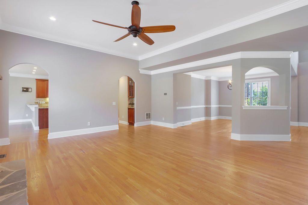 4174 Highglen Trace Northeast Dacula, GA 30019 - Photo 13 of 48 a view of an empty room with window and wooden floor