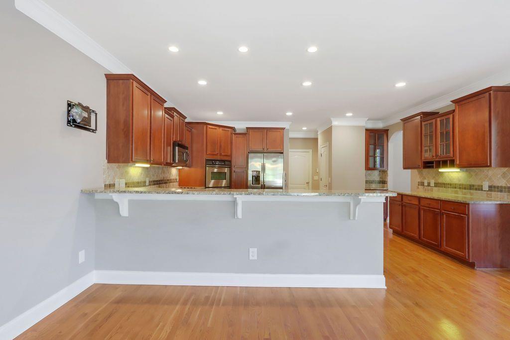 4174 Highglen Trace Northeast Dacula, GA 30019 - Photo 18 of 48 a view of kitchen with wooden floor