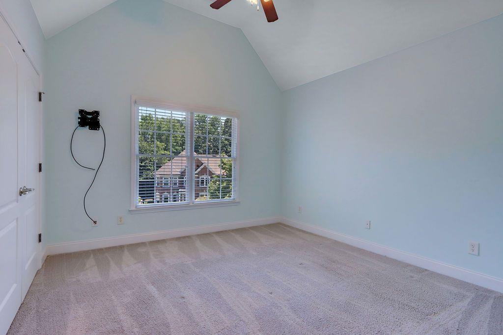 4174 Highglen Trace Northeast Dacula, GA 30019 - Photo 32 of 48 a view of a livingroom with wooden floor and window