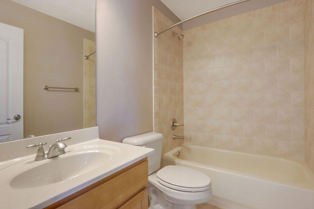 4174 Highglen Trace Northeast Dacula, GA 30019 - Photo 34 of 48 a bathroom with a sink a toilet and a bathtub