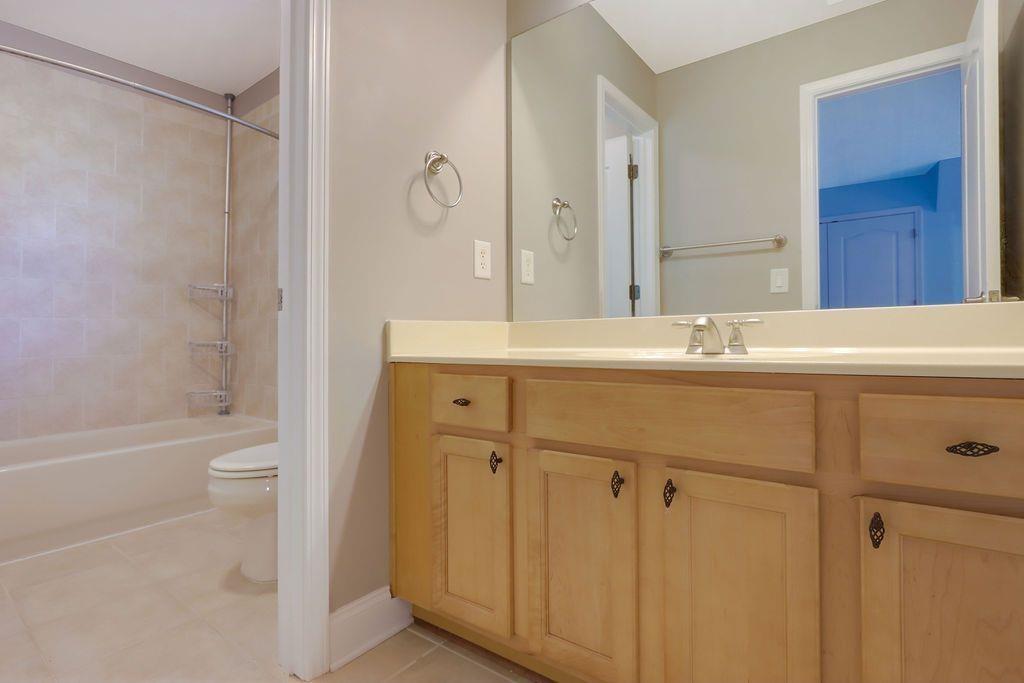 4174 Highglen Trace Northeast Dacula, GA 30019 - Photo 38 of 48 a bathroom with a sink a toilet and shower