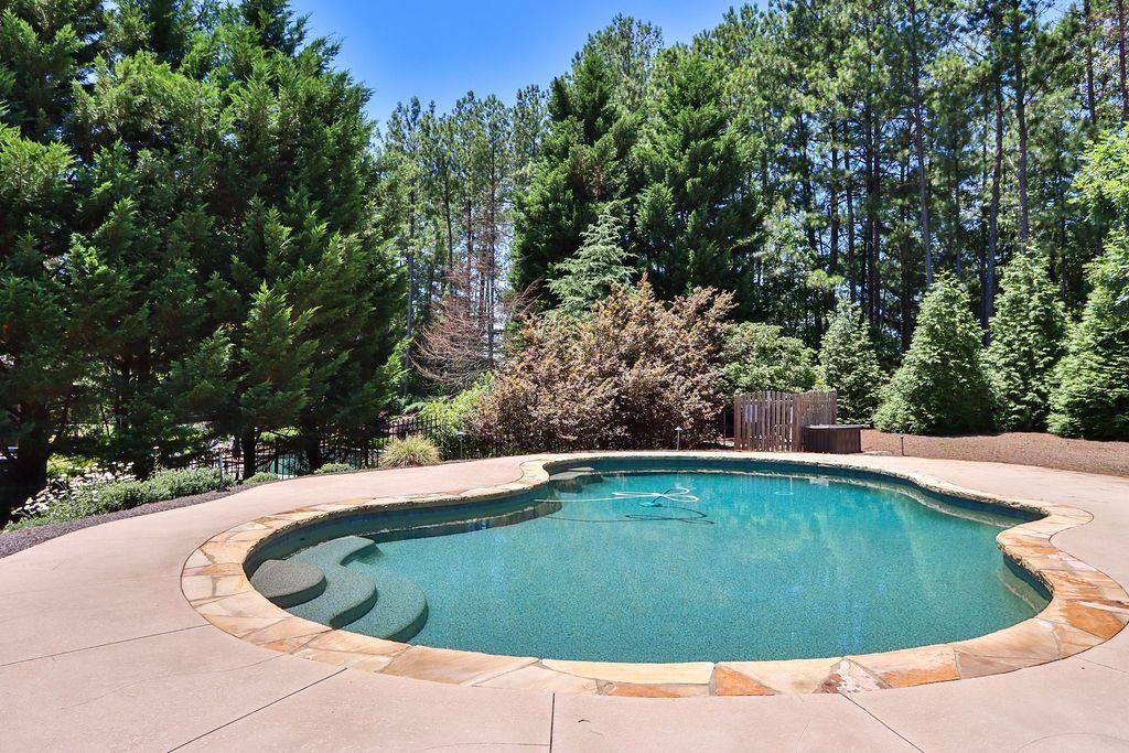 4174 Highglen Trace Northeast Dacula, GA 30019 - Photo 4 of 48 a view of outdoor space and swimming pool