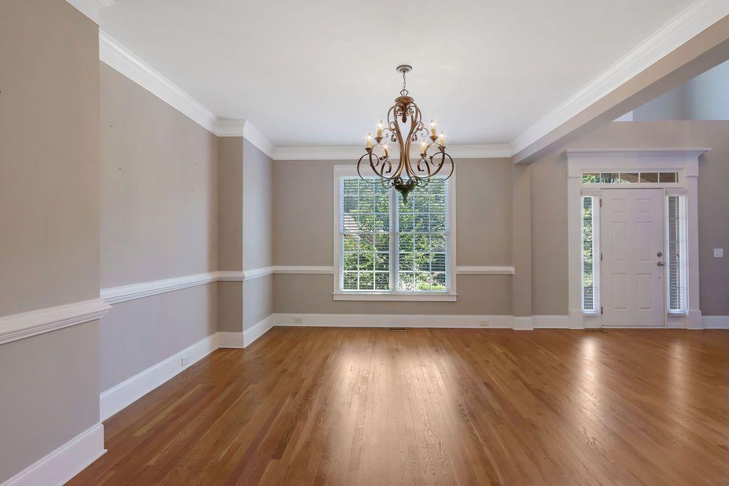 4174 Highglen Trace Northeast Dacula, GA 30019 - Photo 10 of 48 a view of a livingroom with wooden floor and a window