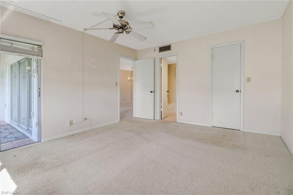 9 High Point Circle North, Unit 106 Naples, FL 34103 - Photo 22 of 35 Master bedroom with ensuite