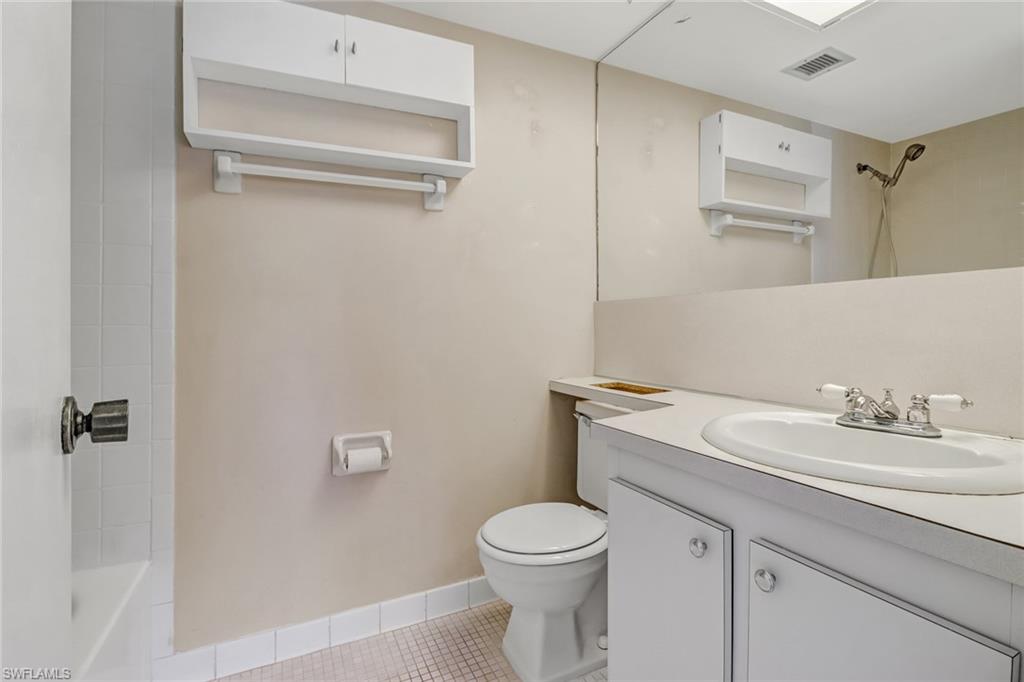 9 High Point Circle North, Unit 106 Naples, FL 34103 - Photo 23 of 35 Master bedroom bathroom