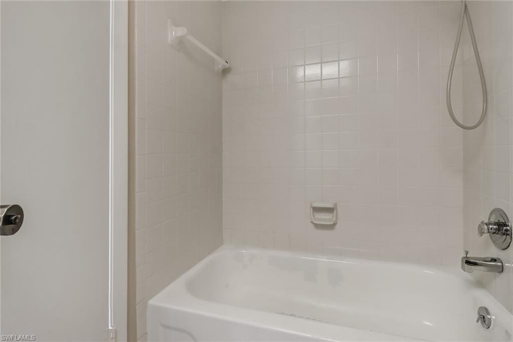 9 High Point Circle North, Unit 106 Naples, FL 34103 - Photo 24 of 35 Master bedroom bathroom
