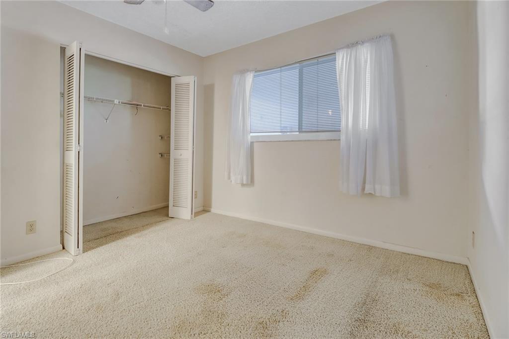 9 High Point Circle North, Unit 106 Naples, FL 34103 - Photo 25 of 35 Guest bedroom