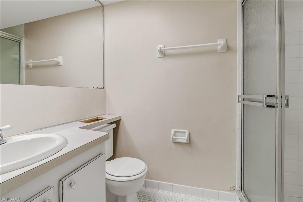 9 High Point Circle North, Unit 106 Naples, FL 34103 - Photo 28 of 35 Guest bathroom