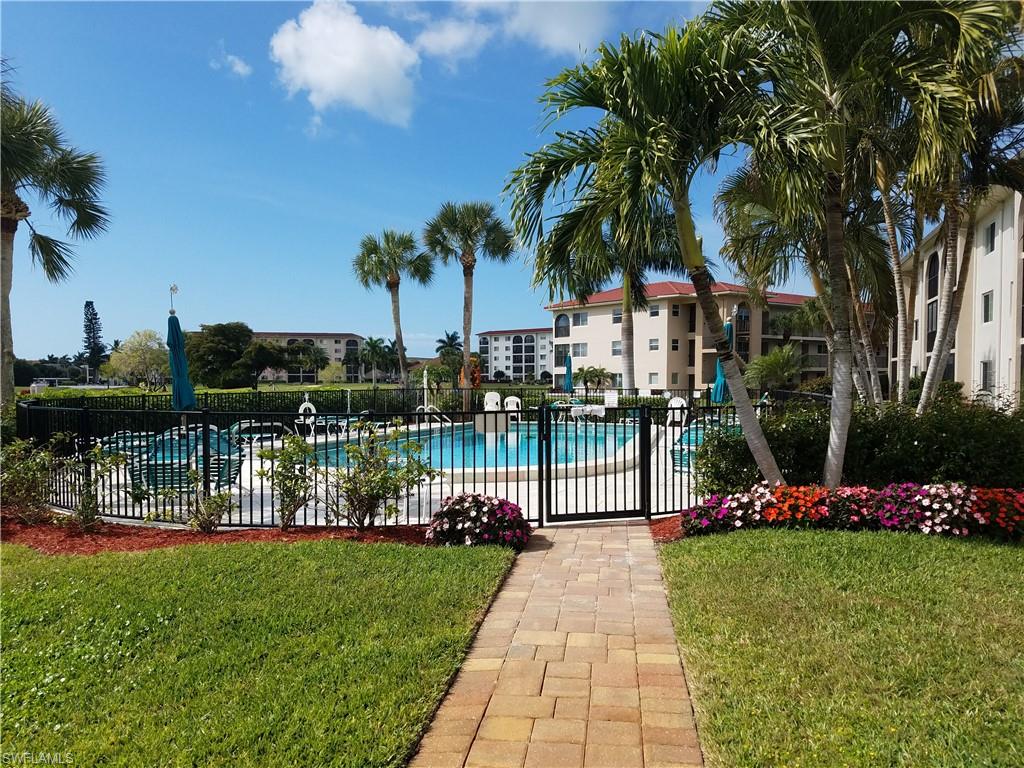 9 High Point Circle North, Unit 106 Naples, FL 34103 - Photo 29 of 35 The pool closest to the condo