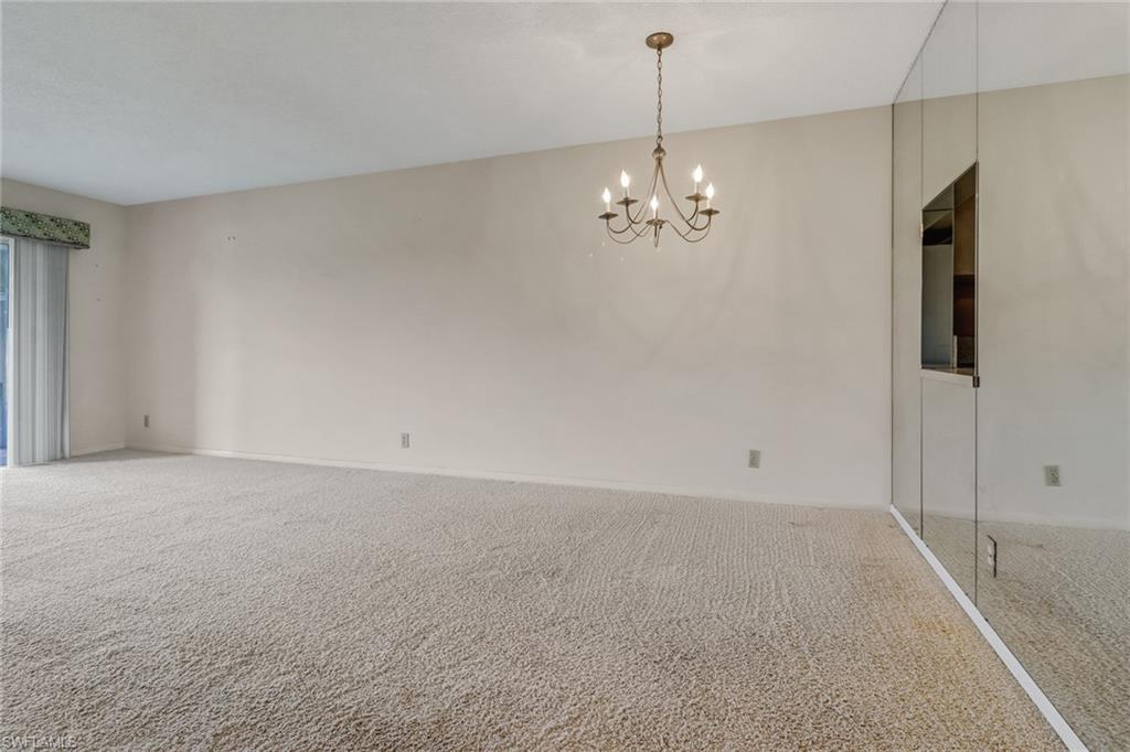 9 High Point Circle North, Unit 106 Naples, FL 34103 - Photo 10 of 35 Living room and dining room