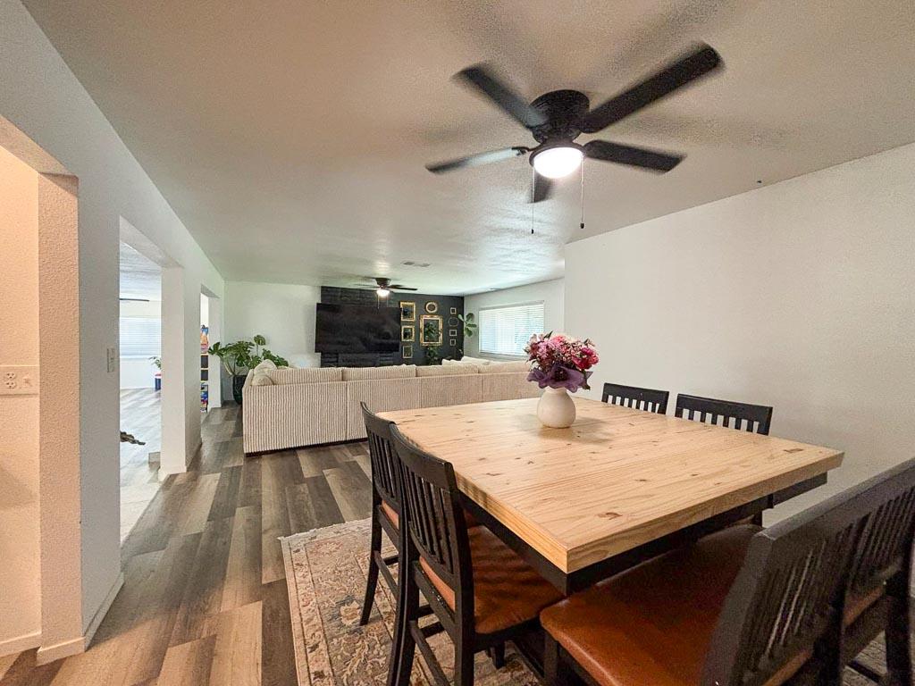 1237 De Cesari Avenue Madera, CA 93637 - Photo 14 of 33 a view of a dining room with furniture and a livingroom