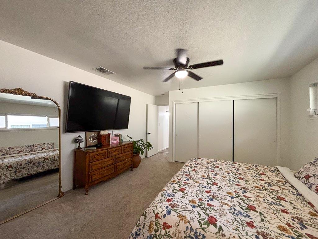 1237 De Cesari Avenue Madera, CA 93637 - Photo 19 of 33 a living room with furniture and a flat screen tv