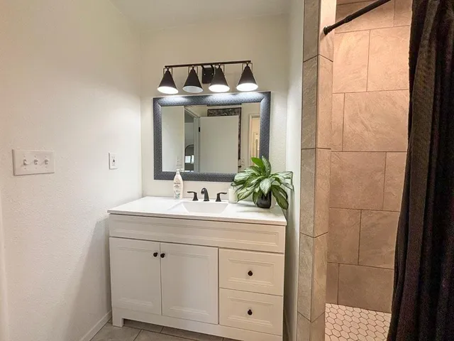 a living room with lots of furniture and a flat screen tv
