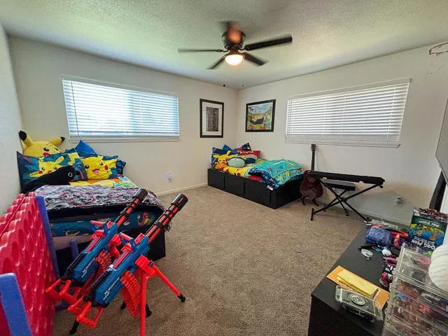 a bedroom with furniture and a window