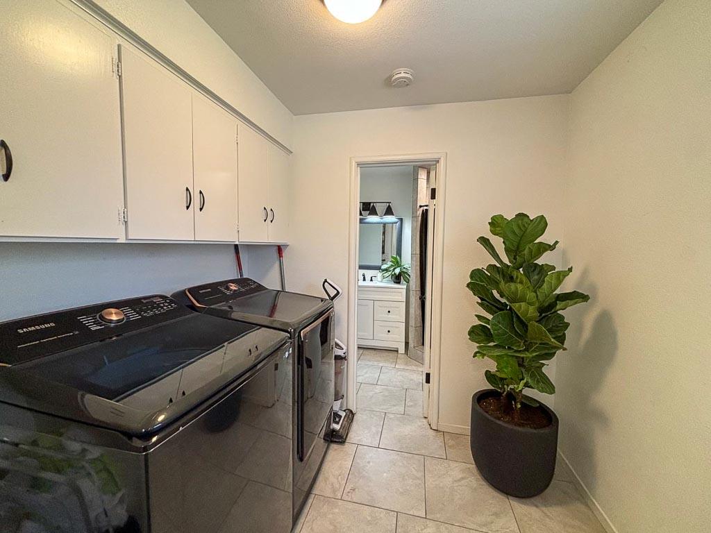 1237 De Cesari Avenue Madera, CA 93637 - Photo 25 of 33 a kitchen with a stove and a white cabinets