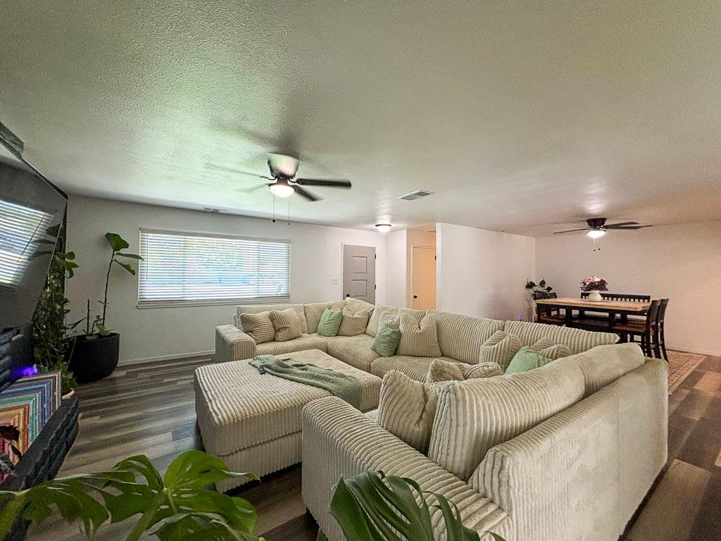 1237 De Cesari Avenue Madera, CA 93637 - Photo 5 of 33 a living room with furniture and a flat screen tv