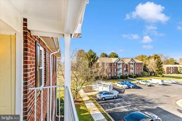 a view of a swimming pool with an outdoor space and seating area