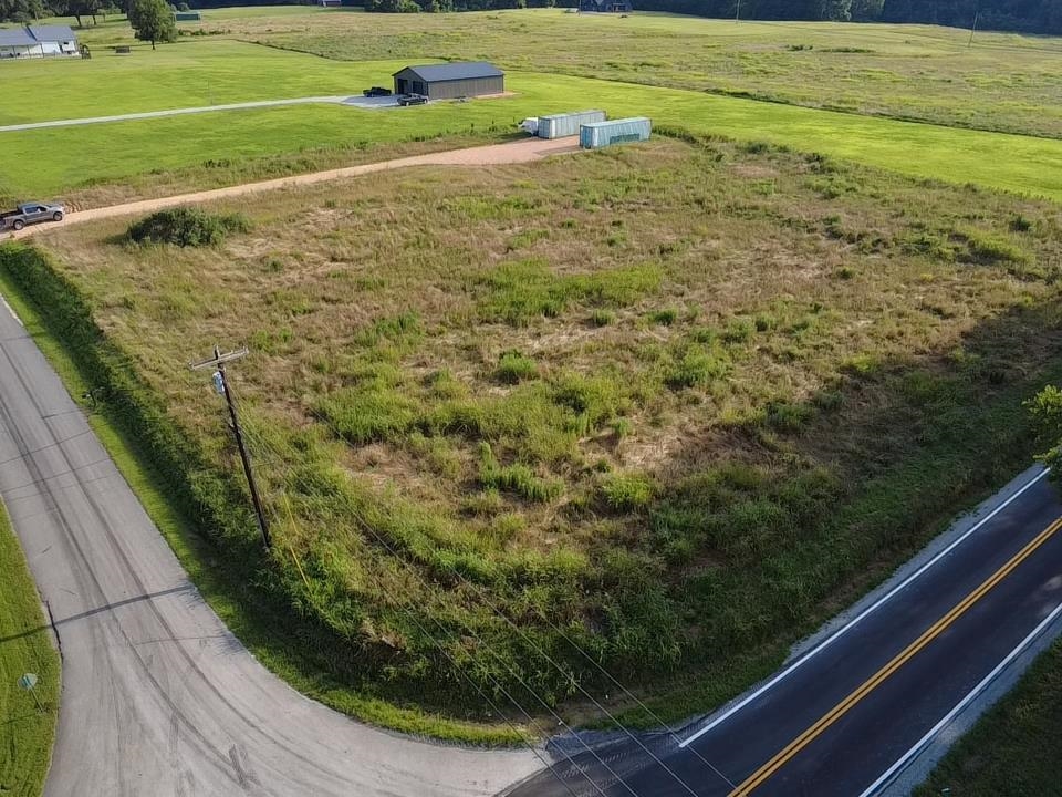 a view of a field with an outdoor space